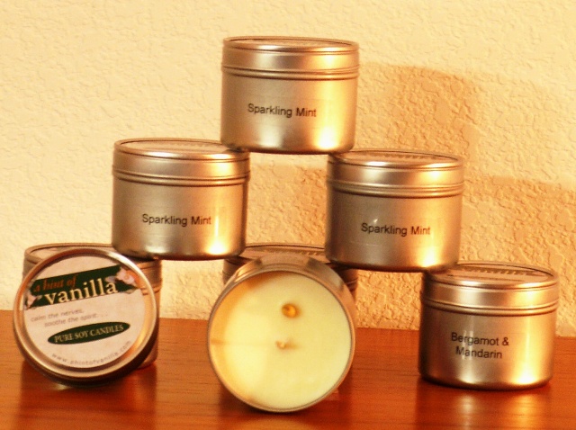 Candles in four ounce travel tins Four ounce travel tins